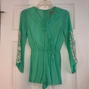Green Long Sleeved Romper with Lace Detailing